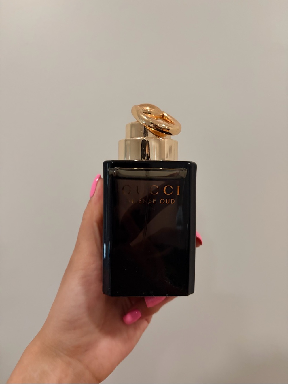 Fragrance bottle being held